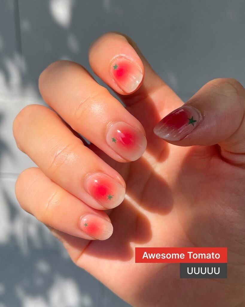 Red ombre tomato-themed gel nail ideas for short nails with green stars and gradient fade.