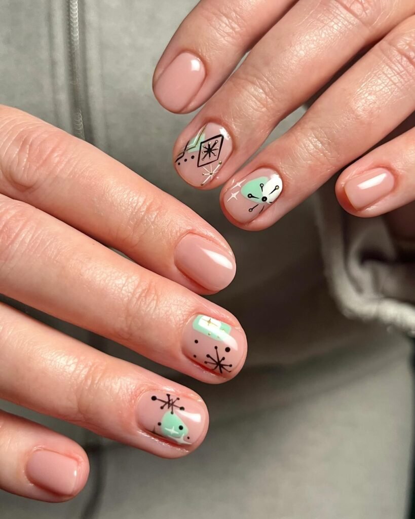 Retro pastel geometric and star gel nail ideas for short nails in pink and mint with black outlines.