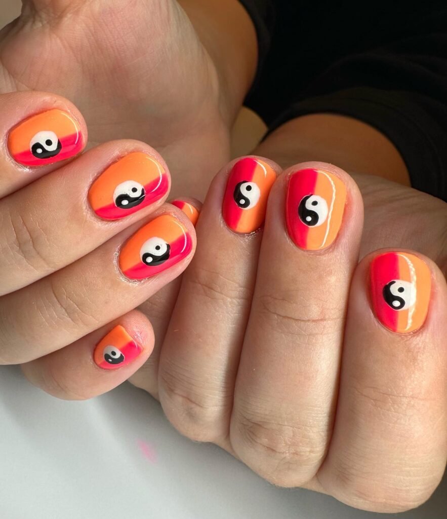 Bold orange-pink gradient yin-yang gel nail ideas for short nails.