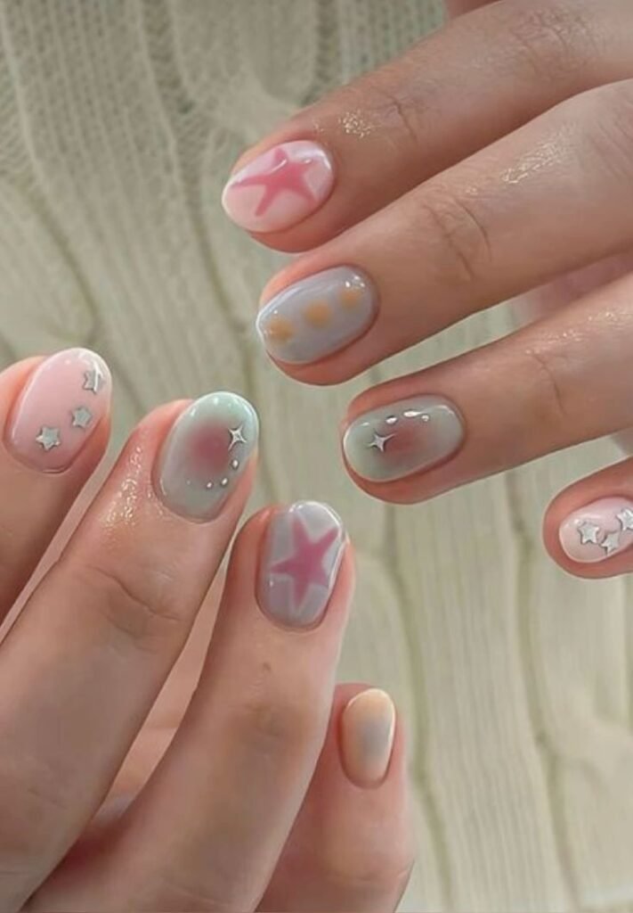 Adorable pastel star and starfish designs on short nail ideas for summer, perfect for a playful yet elegant look.