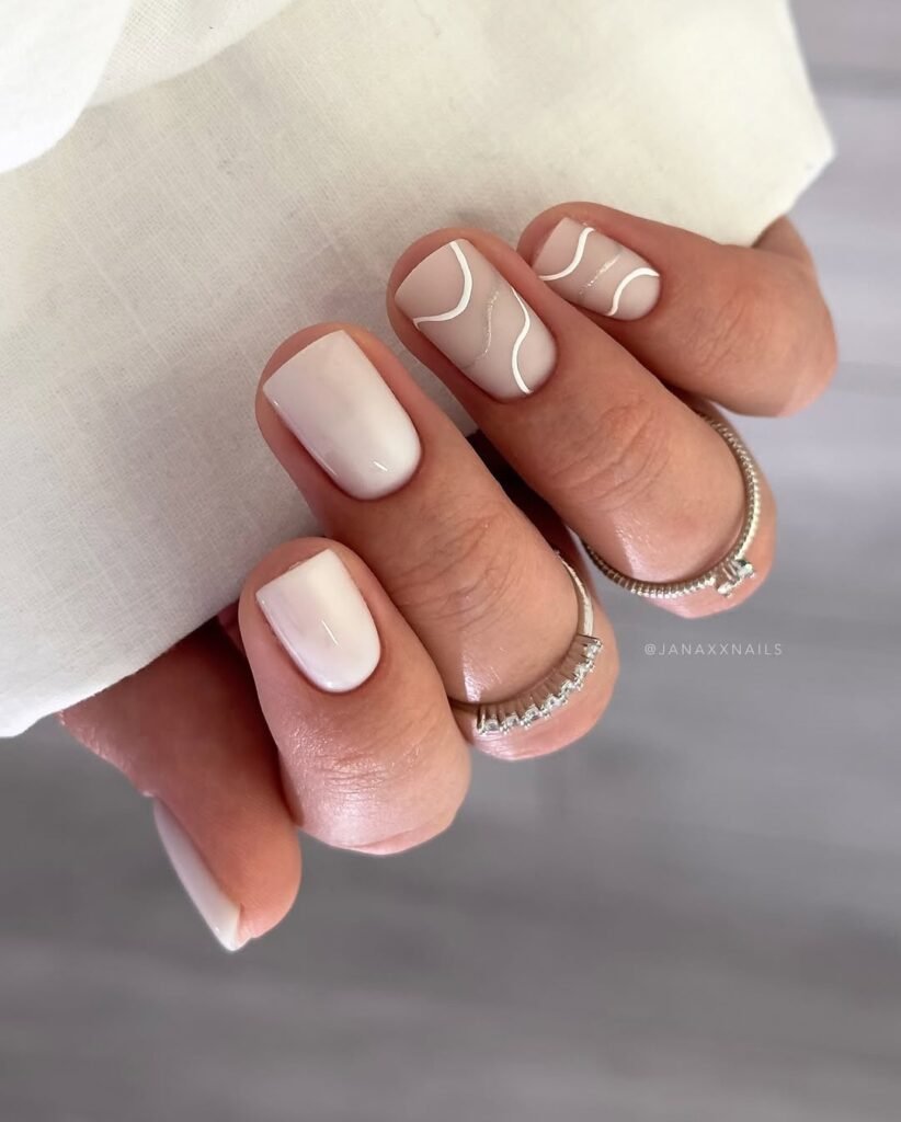 Elegant nude wavy line designs as short square nails ideas for a minimalist look.