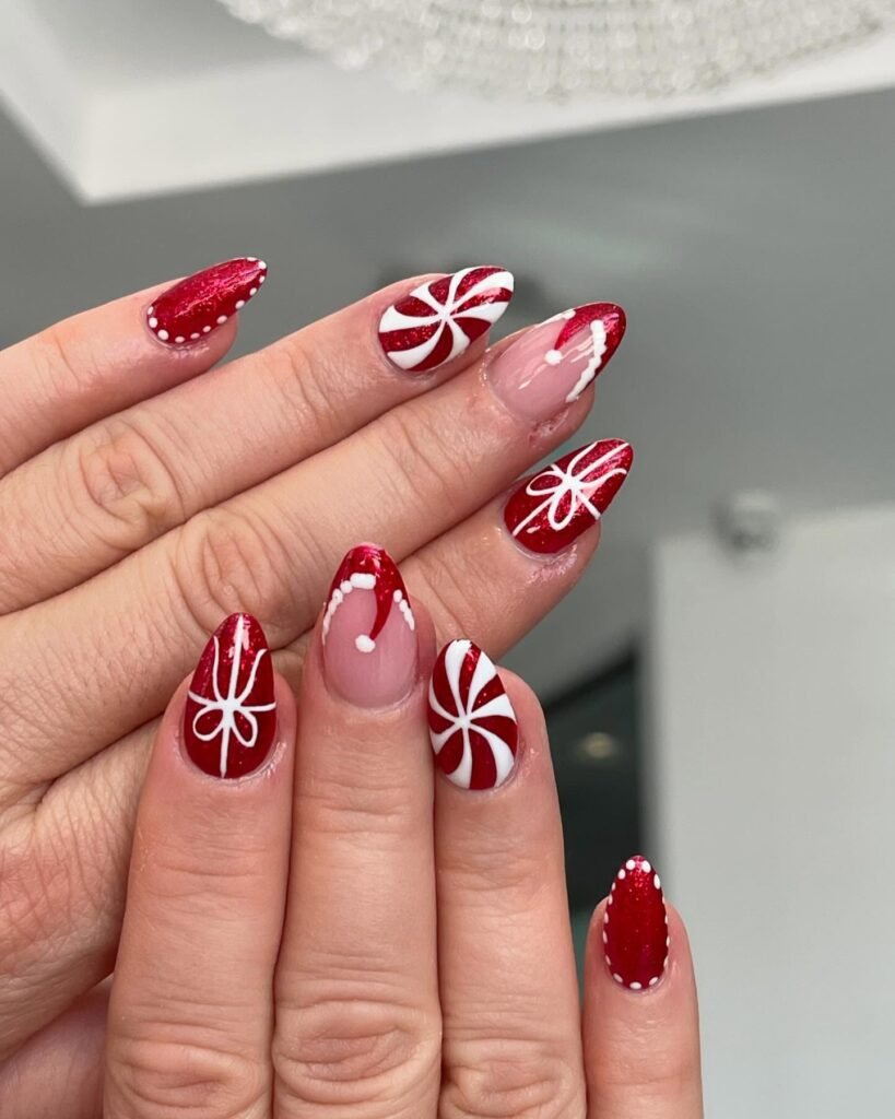 Dive into festive short almond nails ideas showcasing vibrant red glitter bases with intricate white patterns including candy canes, peppermint swirls, holiday bows, and Santa hats for a sparkling and cheerful Christmas-themed manicure.