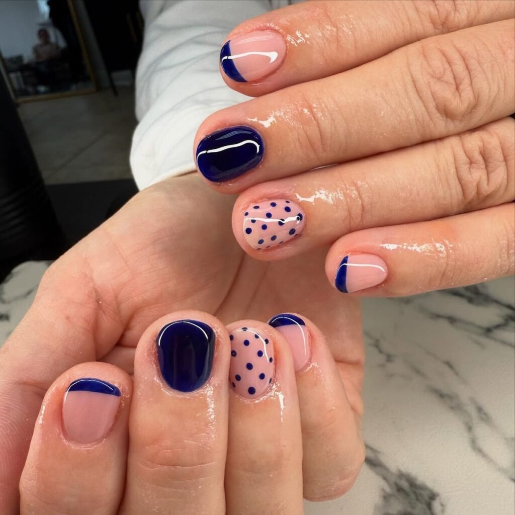 Playful Pink Short Nails Ideas mixed with navy accents and polka dot patterns.