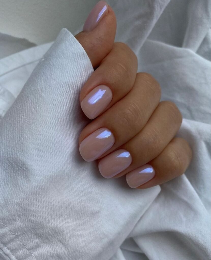 Creative nude short nails ideas with iridescent gradient effects for a modern, ethereal style.