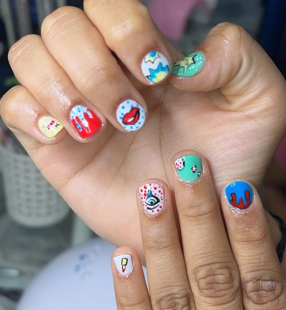 Very short nails ideas inspired by colorful pop art icons.