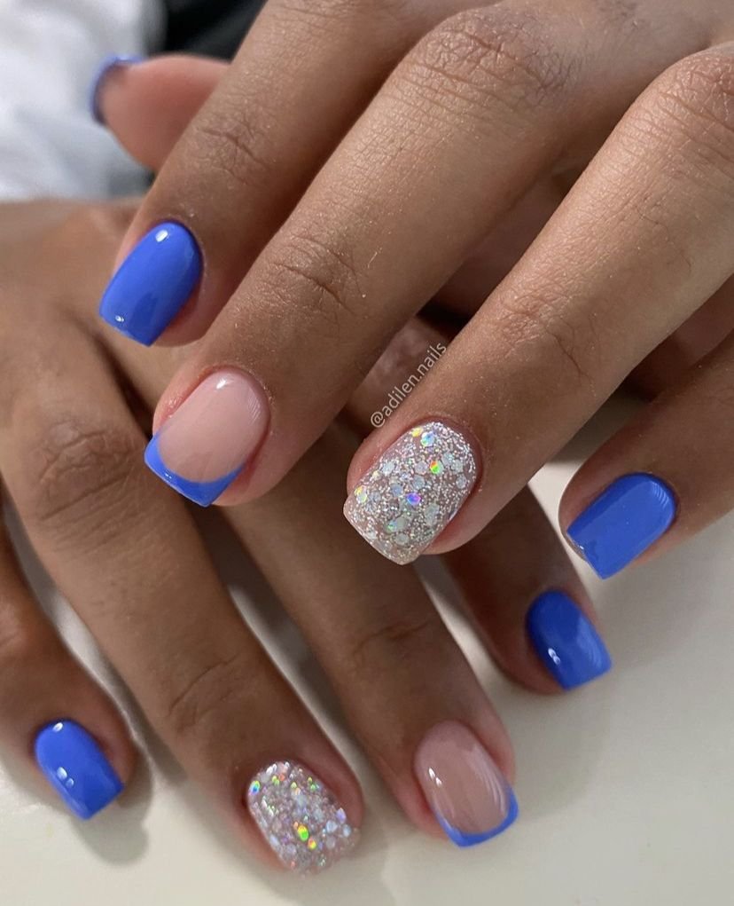Creative blue short nails ideas mixing solid blue, French tips, and holographic glitter for everyday style.
