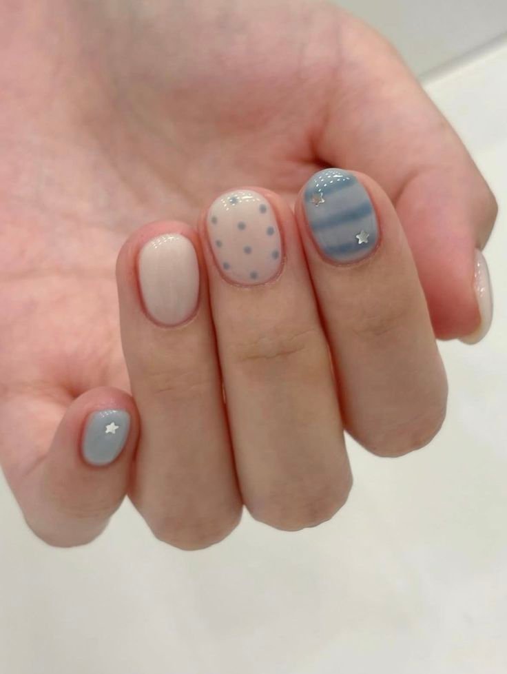 Inspiring short spring nails ideas with pastel colors, polka dots, stripes, and star details for a whimsical look.