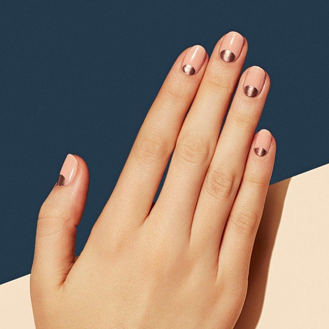Chic anniversary nails ideas with nude bases and metallic bronze tips for a sophisticated look.