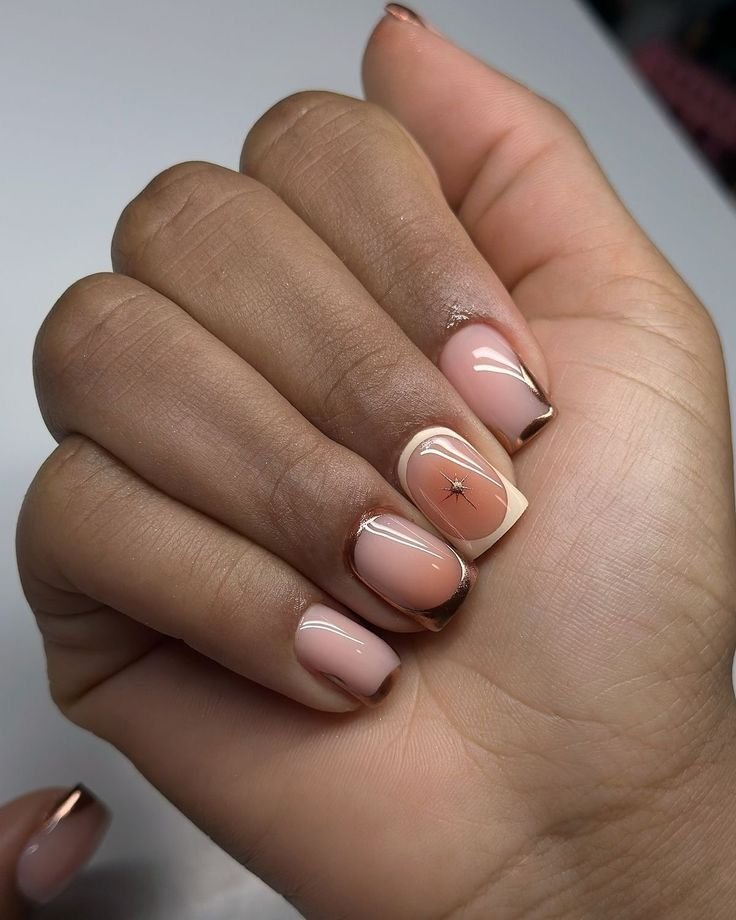 Creative nude short nails ideas incorporating bronze French tips and a star accent for an elegant twist.