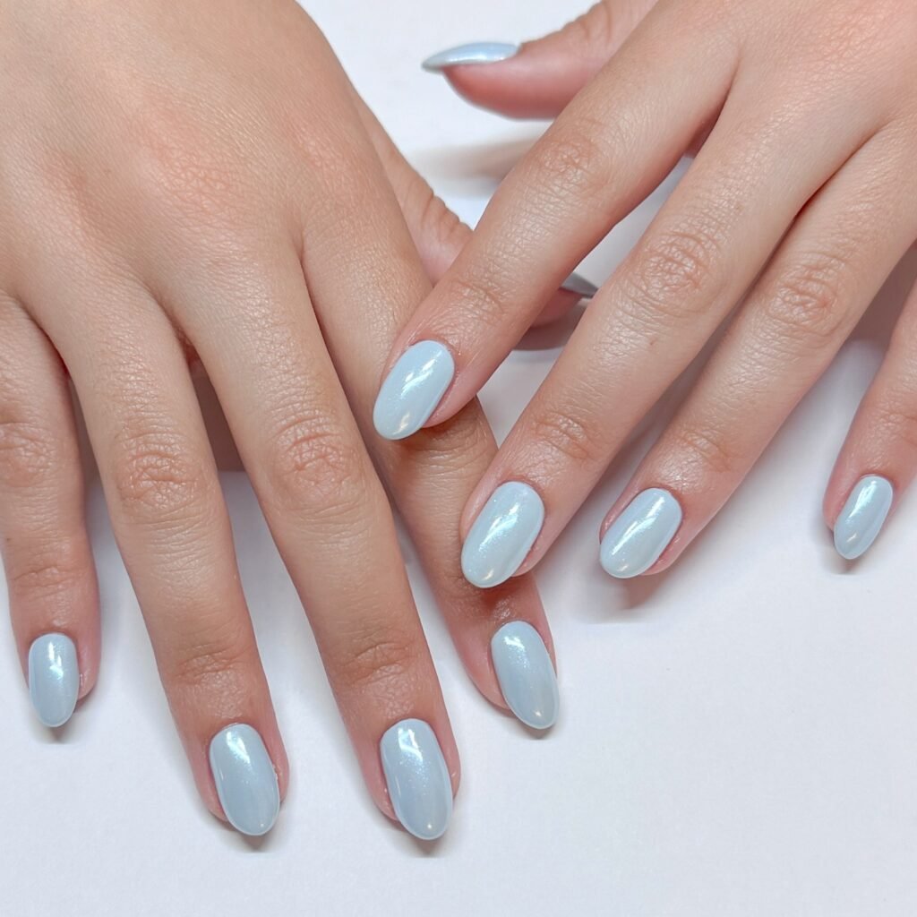 Modern engagement nails ideas in soft blue chrome for a fresh and elegant manicure.