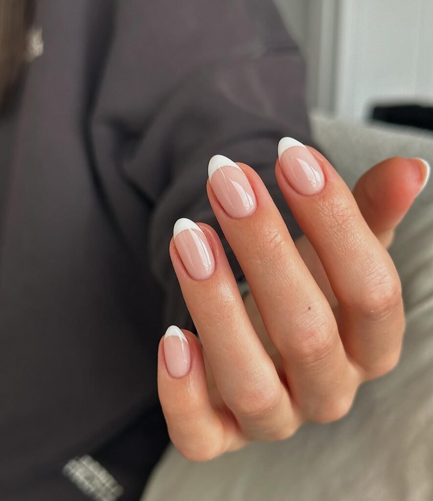 Classic engagement nails ideas with elegant French tips for a timeless bridal manicure.