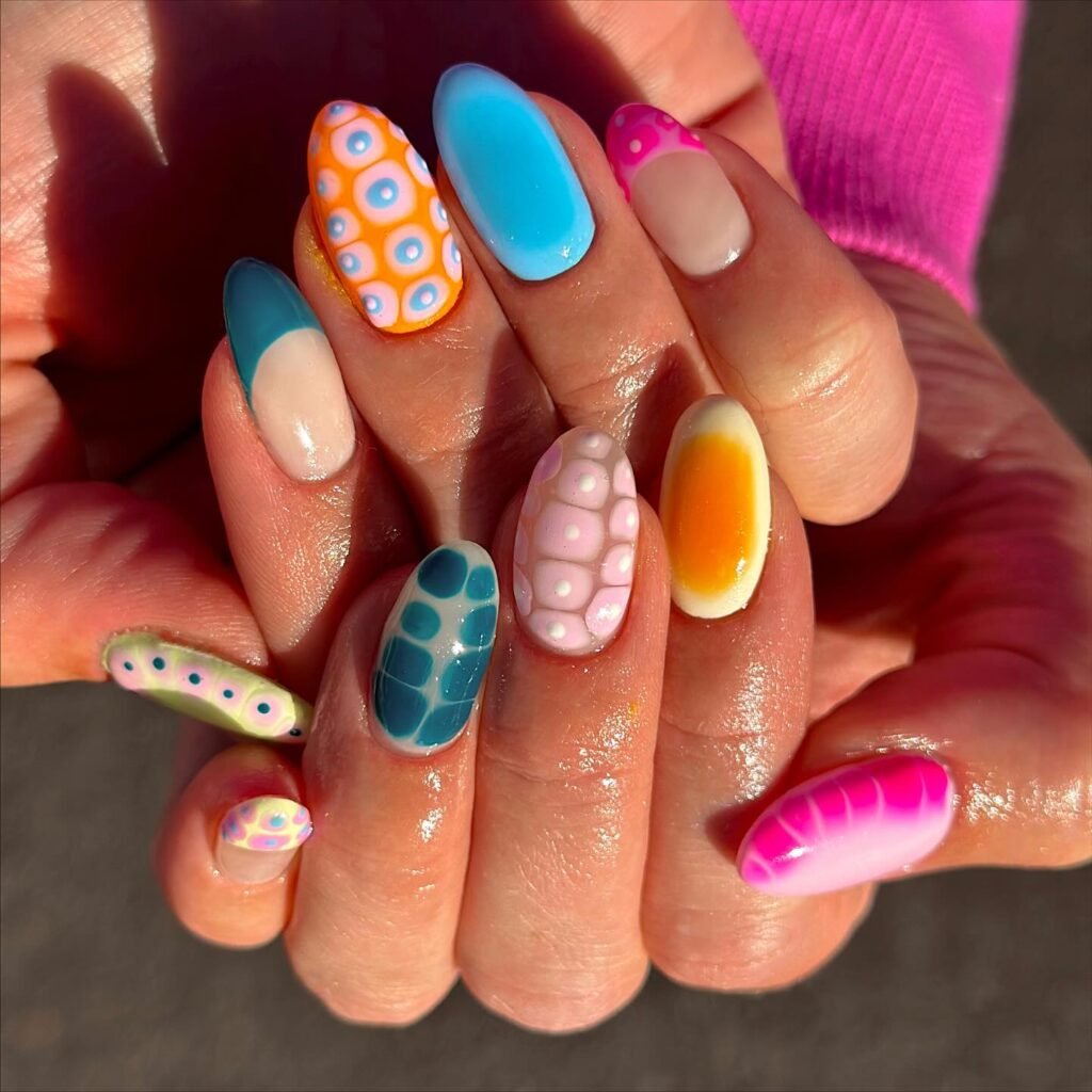 Fun hawaii nails ideas showcasing vibrant retro patterns like dots and scales in tropical colors for a playful summer look.