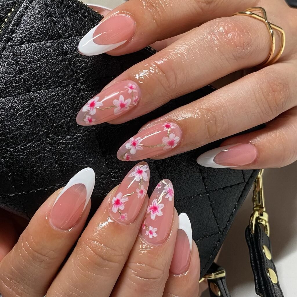 Delicate cherry blossom floral May nails ideas on nude base with white tips for a spring-inspired manicure.