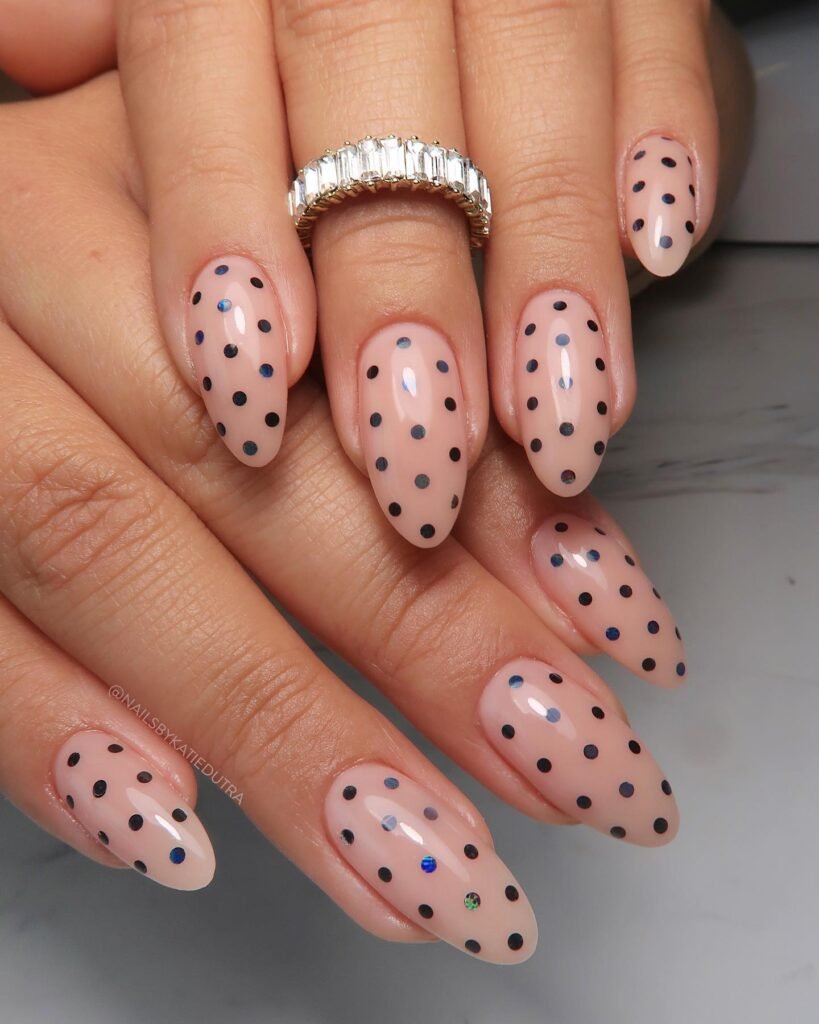 Stylish polka dot design on pink almond nails, perfect for may nails ideas that add a fun and retro vibe.