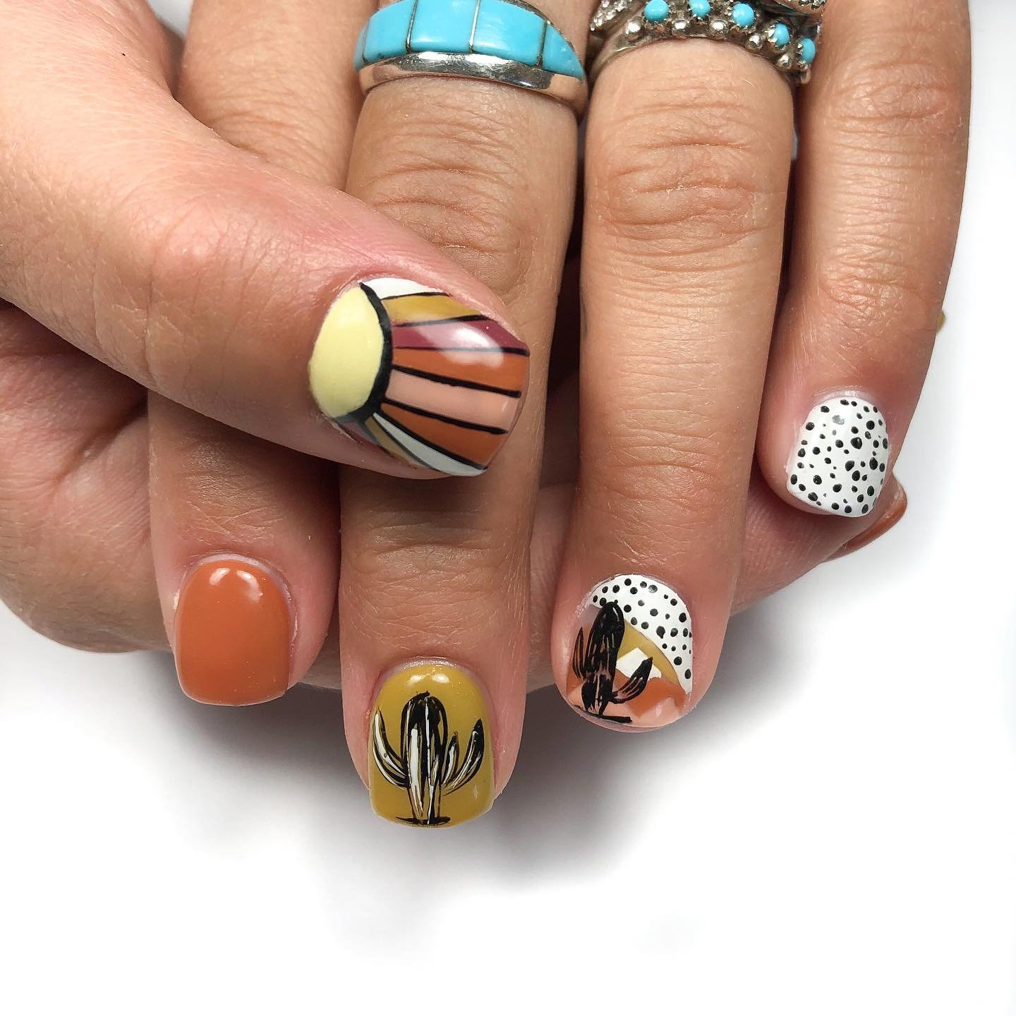 Creative cactus and sunset nail designs showcasing Nashville Nails Ideas