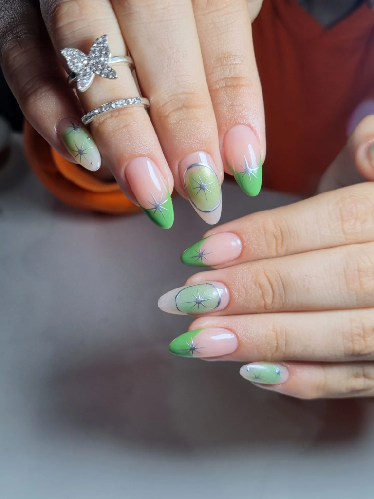 Trendy green ombre tips with silver starburst designs showcasing aesthetic nails ideas