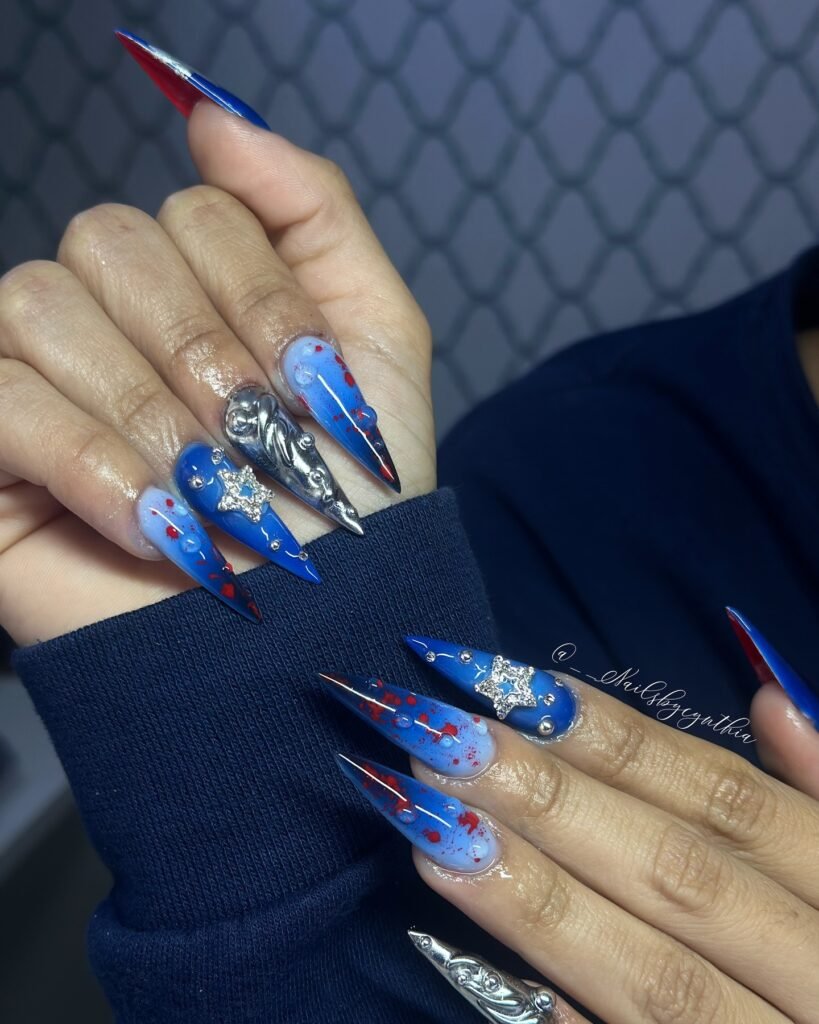 Extreme long stiletto blue and red splatter billie eilish nails ideas with 3D chrome details