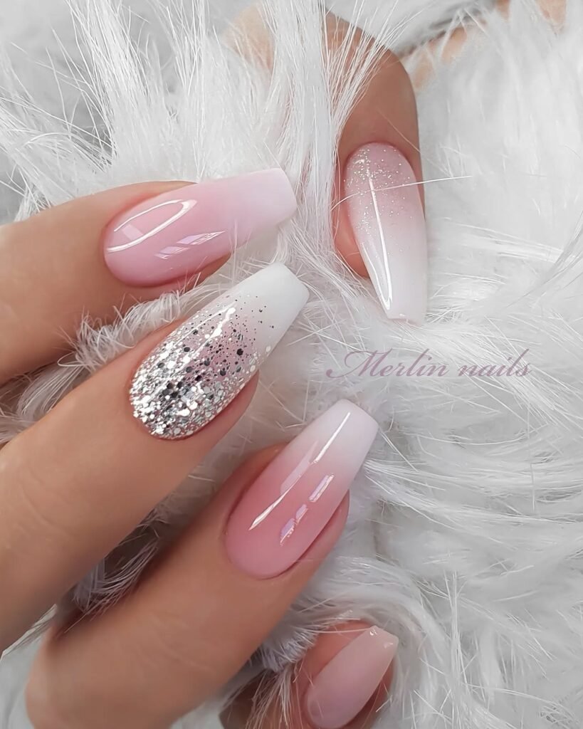 Stunning pink and white ombre clear nails ideas with sparkling silver glitter and metallic flakes for a dreamy look