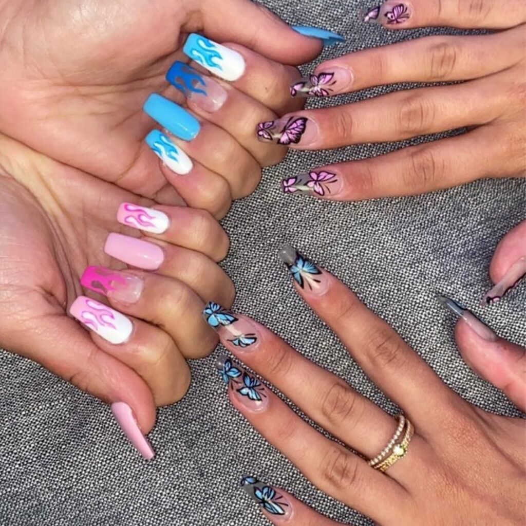 Bold flame and butterfly best friend nails ideas with pink, blue, and white accents on long square nails