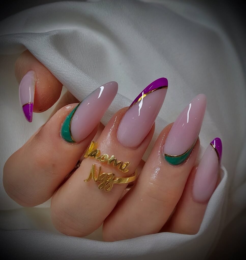 Baby pink nails with purple and green French tips in stylish Mardi Gras nails ideas