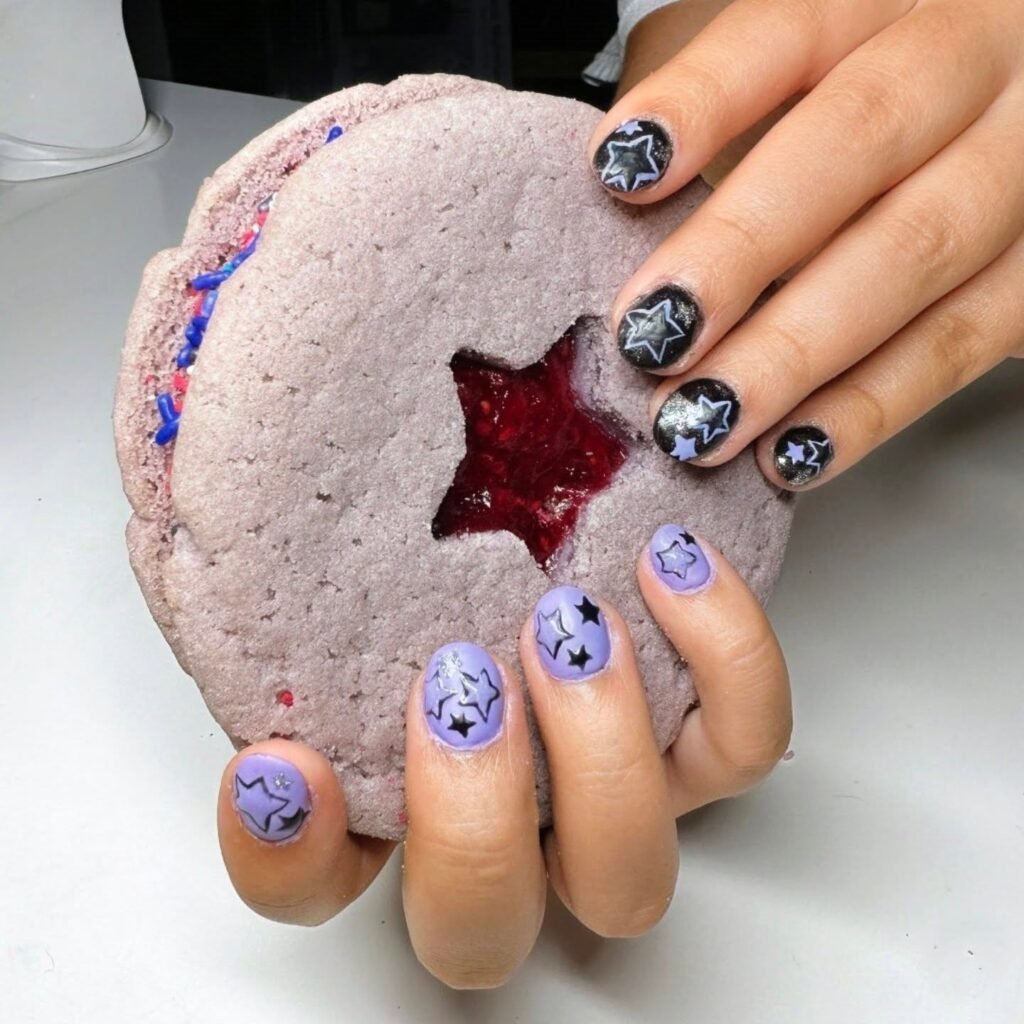 Fun olivia rodrigo nails ideas with black and purple glitter star nail art