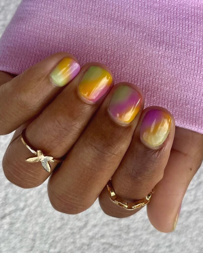 Soft watercolor purple yellow green pink nails perfect summer Mardi Gras nails ideas