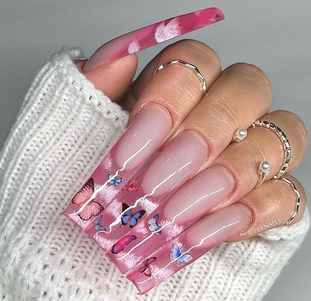 Elegant pink gradient nails featuring colorful butterflies in this must-try painted nails ideas look