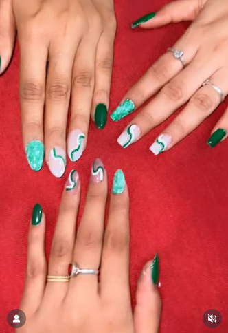 Chic green and teal marble swirl best friend nails ideas with glossy finish and accent rings