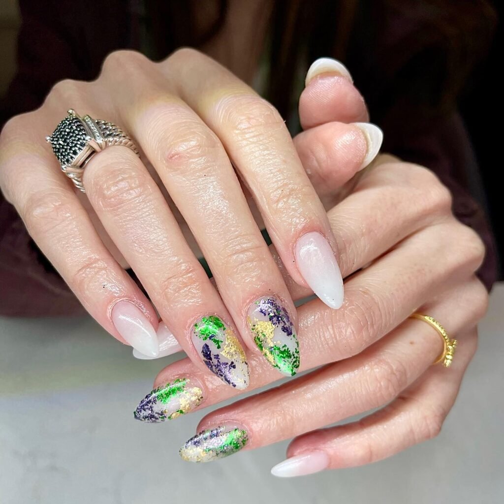 White tipped nails with purple green gold glitter flakes in beautiful Mardi Gras nails ideas