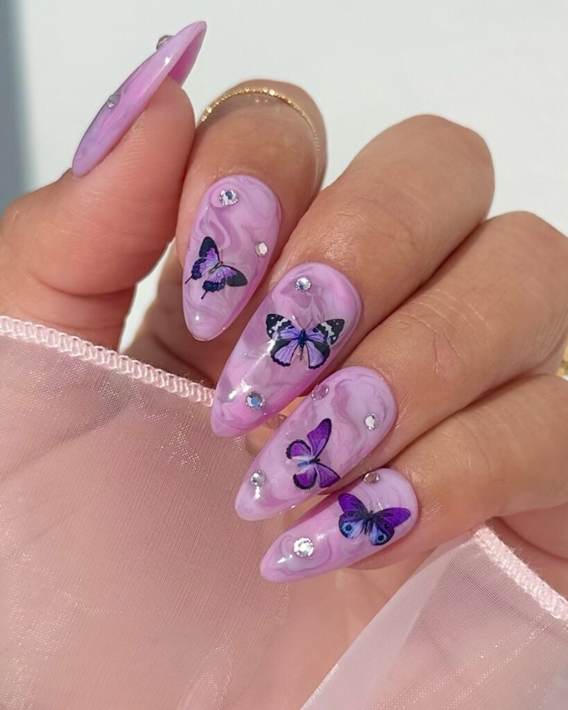 Elegant purple marble butterfly gender reveal nails ideas with rhinestones